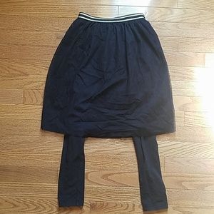 Black Gymboree skirt over leggings
